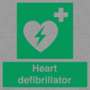 green-background-with-white-text-and-heart-defibrillator-symbol--white-cross-and~
